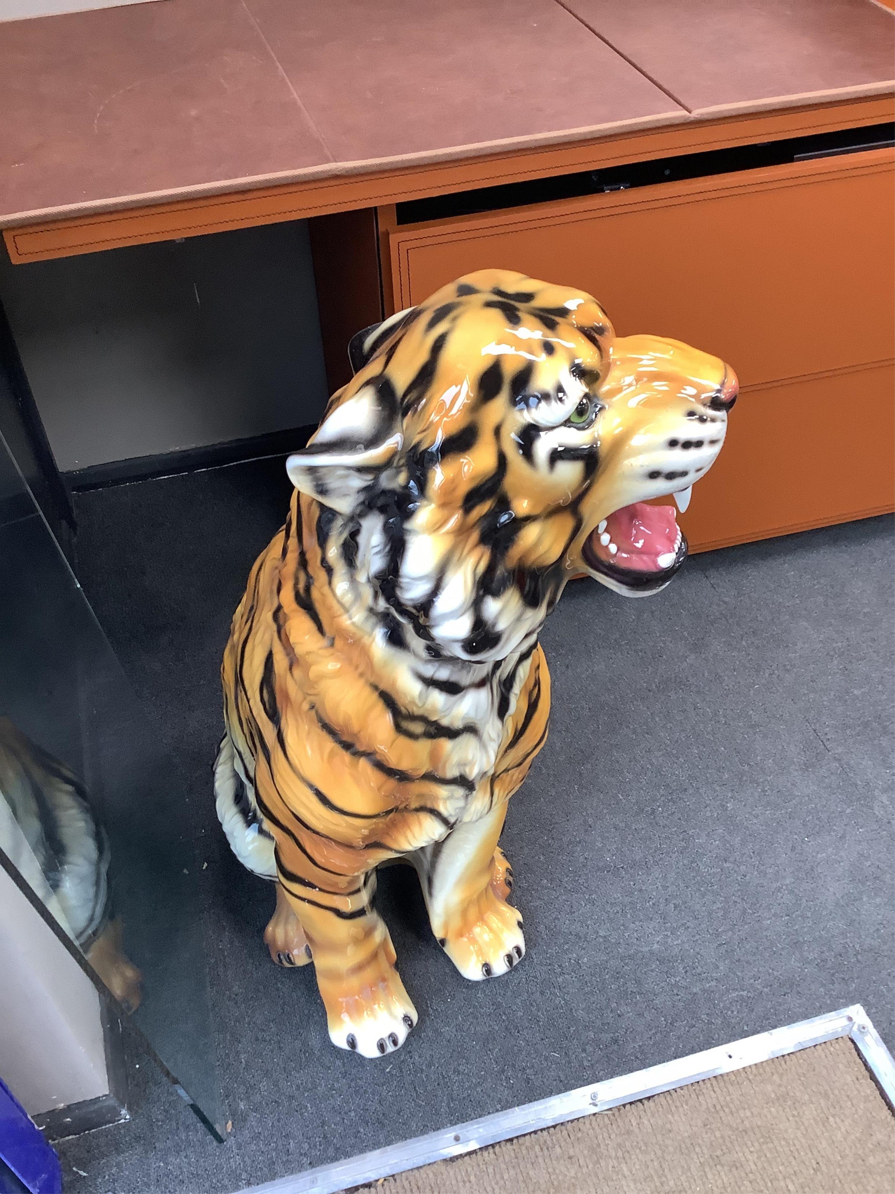 An Italian majolica seated tiger, height 90cm. Condition - good